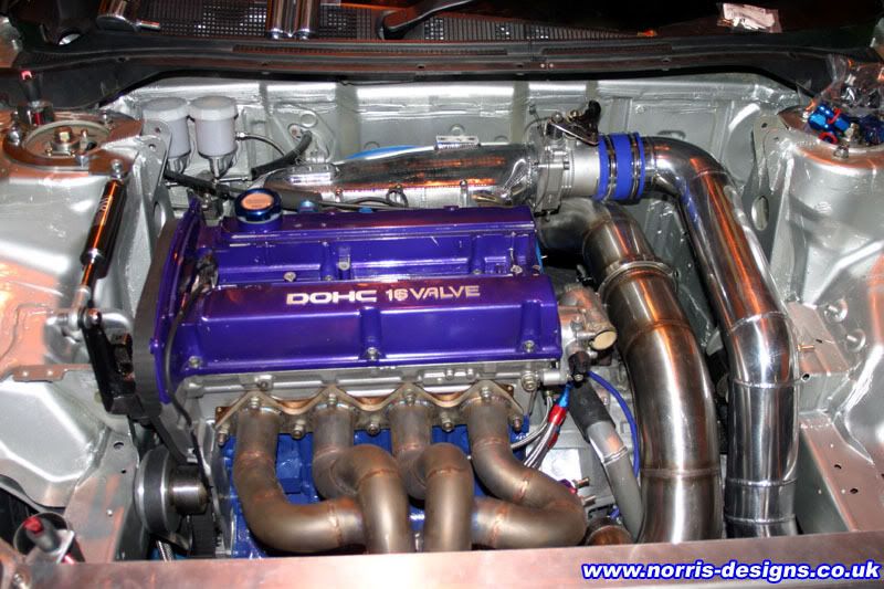 http://i334.photobucket.com/albums/m429/VOTBLINDUB/Random%20Car%20Photos/evo9-engine-exhaust.jpg